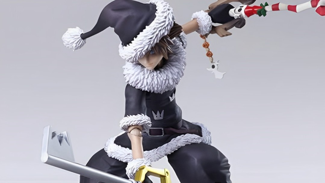 Sora wields a Key Blade and a candy cane, dressed in black Santa clothes.