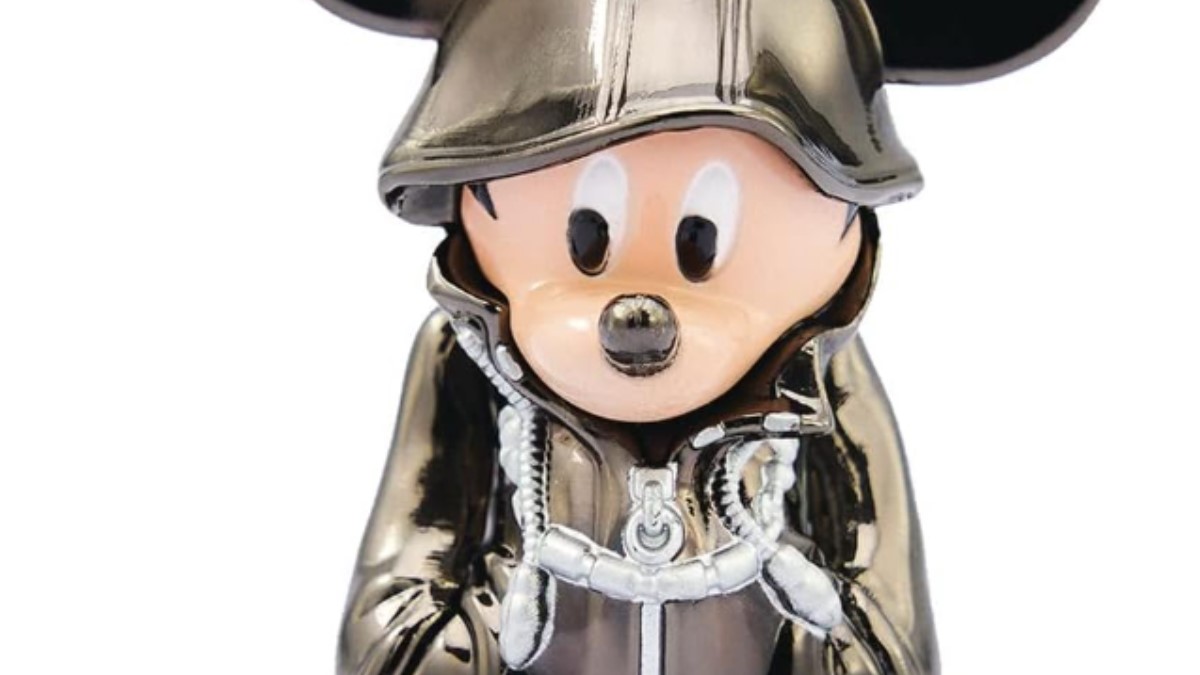 Mickey buries his hands in his silver hoodie